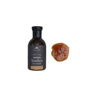 A bottle of Sweet Bourbon Grilling Sauce Sweet + Savory, accompanied by a helping of the sauce on a white background, finch and fennel 