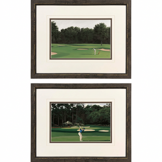 The Fairway Artwork Assorted
Two framed golf art print stacked vertically on a white background. Each print features a golfer on a green golf course with sand bunkers and a dark tree line, matted in cream with a textured dark brown frame