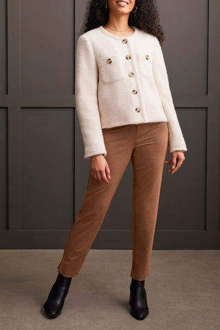 A model wearing a button front, double pocket jacket in moonstone paired with brown pants and black boots.