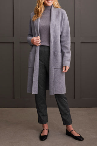 A person wearing a heathered charcoal open-front coatigan with patch pockets over a gray sweater and black pants.