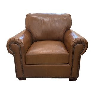 Brown leather armchair on a white background