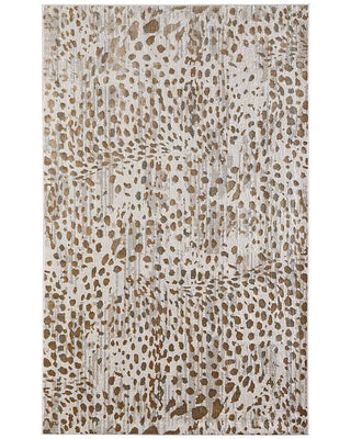Waldor 10'x13'2" Beige Rug
A rectangular area rug with an abstract textured pattern featuring brown and tan spots on a distressed off-white background animal print