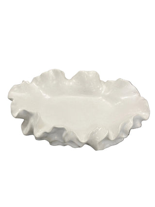 White ceramic dish with textured surface on a white background
