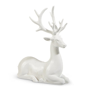 White sitting deer statue