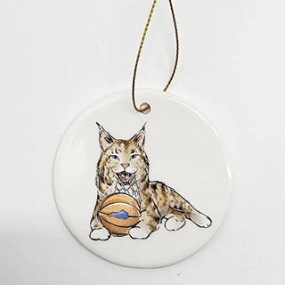 A ceramic ornament featuring a cartoon image of a wildcat with a basketball. Wildcat with Basketball Kentucky.