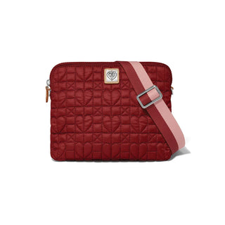 Red quilted bag with a pink strap on a white background. Brighton Alina Medium Cross Body Bag in Garnet