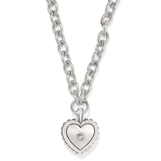 Silver heart-shaped pendant necklace on a white background. Brighton Pretty Tough Bold Two Tone Necklace