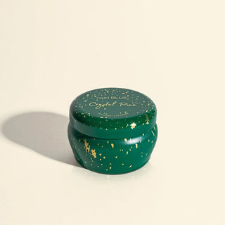 A small green tin Capri BLUE CRYSTAL PINE GLIMMER candle 3oz