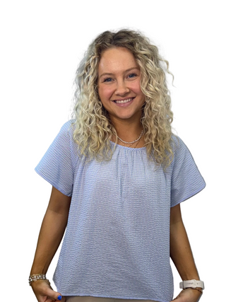 Woman wearing a blue checkered shirt 