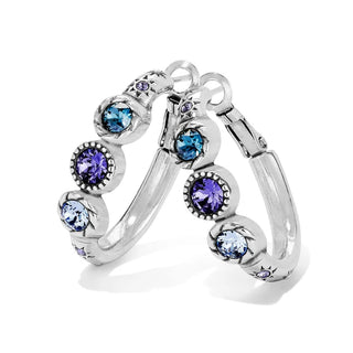 A pair of silver hoop earrings with bezel-set round blue and purple crystals, displayed on a clean white background. Brighton Halo Trio Hoop Earrings