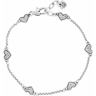 Silver bracelet with heart-shaped charms on a white background. Brighton Kiss & Tell Anklet