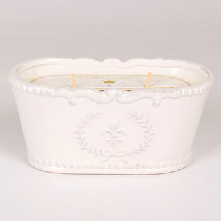 A white ceramic Bourbon Royalty Joie de Vivre candle with an intricate border designs