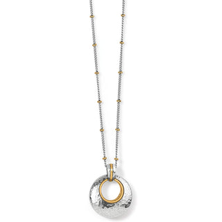 A silver-colored round necklace with hammered details and golden accents on a loop closure. Brighton Ferrara Entrata Petite Necklace