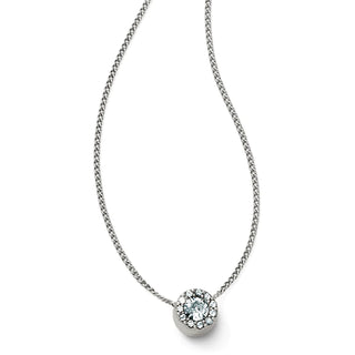 A silver-colored necklace with a lobster claw pendant featuring a central solitaire crystal, surrounded by smaller pave crystals. Brighton Illumina Mini Solitaire Necklace