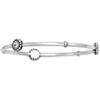A silver-plated bracelet with round charms and fine quality crystal sparkle accents. Brighton Twinkle Round Bangle