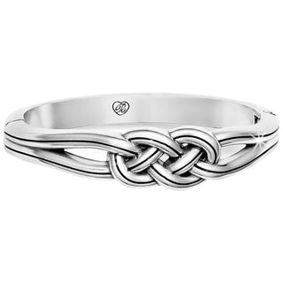 A silver Interlok hinged bangle bracelet with a Celtic-inspired design, featuring a magnetic closure. Brighton Interlok Hinged Bangle