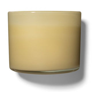 A beige LAFCO candle in a glass jar with a white label, representing the Chamomile Lavender scent.