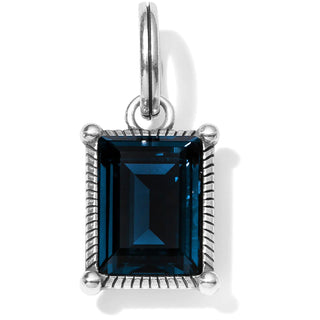 A deep blue crystal emerald cut pendant with silver metal settings, isolated on a white background. Brighton Azul Cristela Amulet